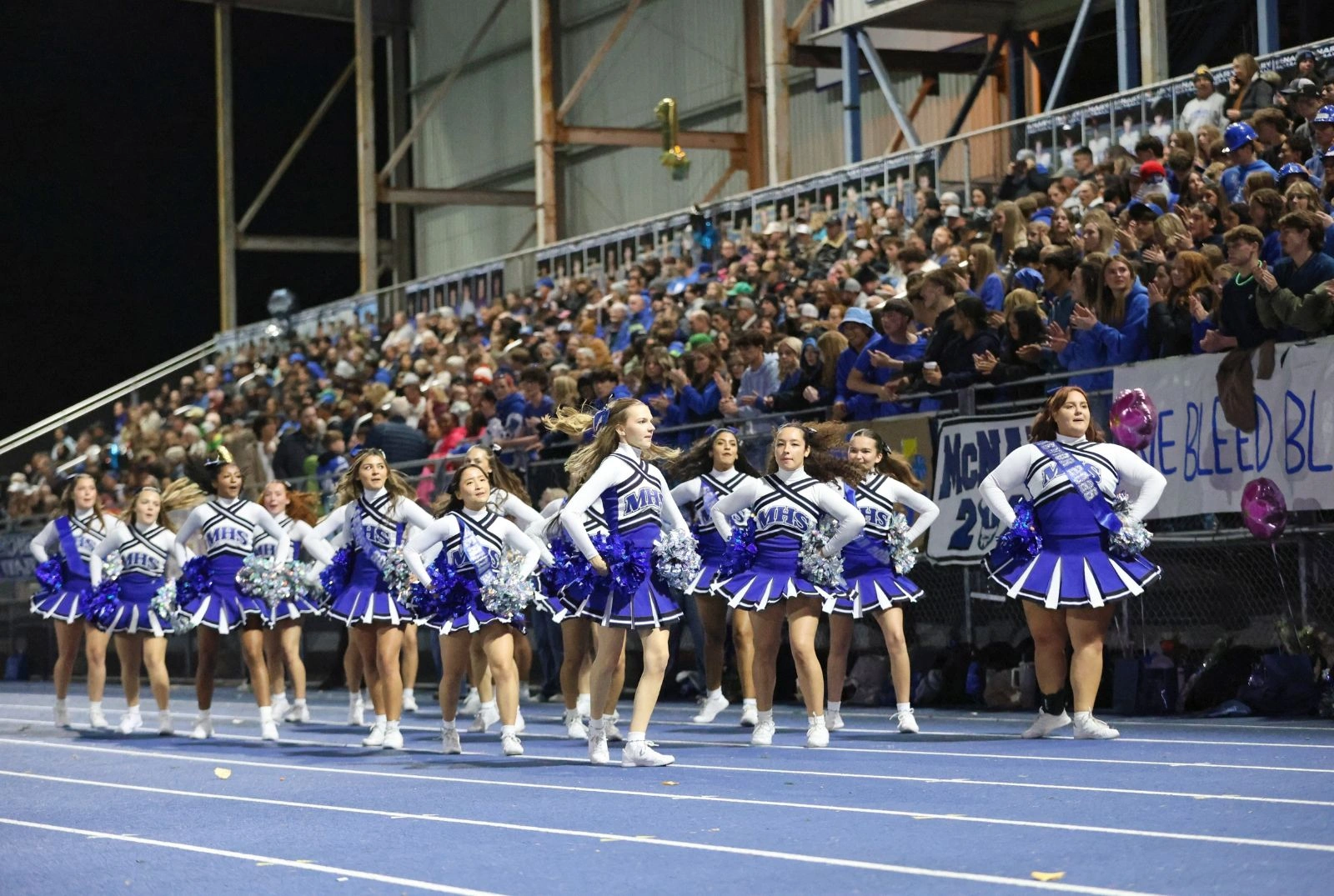 McNary HS Full Cheerleading Team in front of Football Stadium